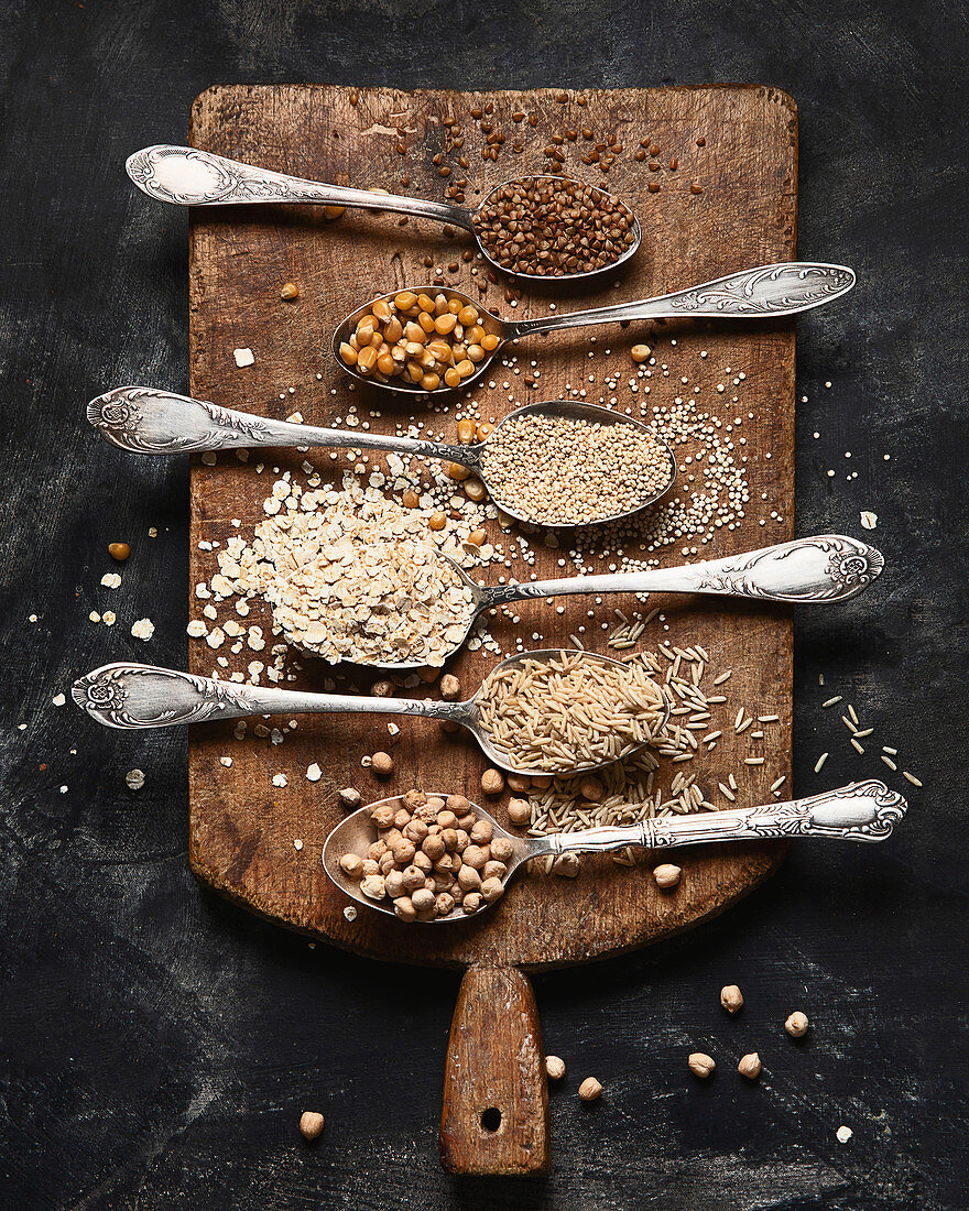 Healthy gluten free grains on rustic wooden board