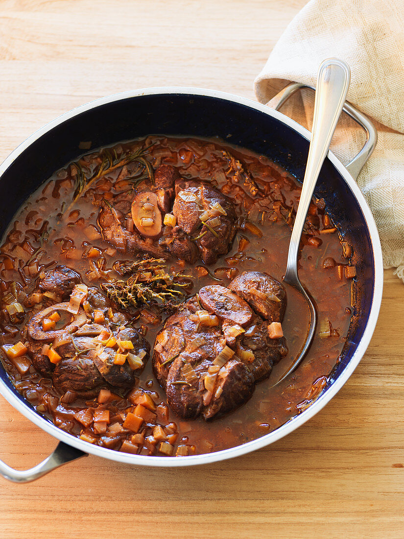 Osso buco (pot-roasted sliced leg of veal, Italy)