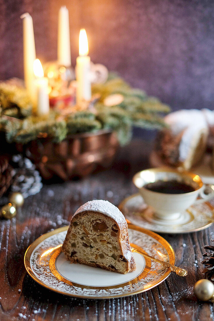 A slice of Christmas Bundt cake with icing sugar