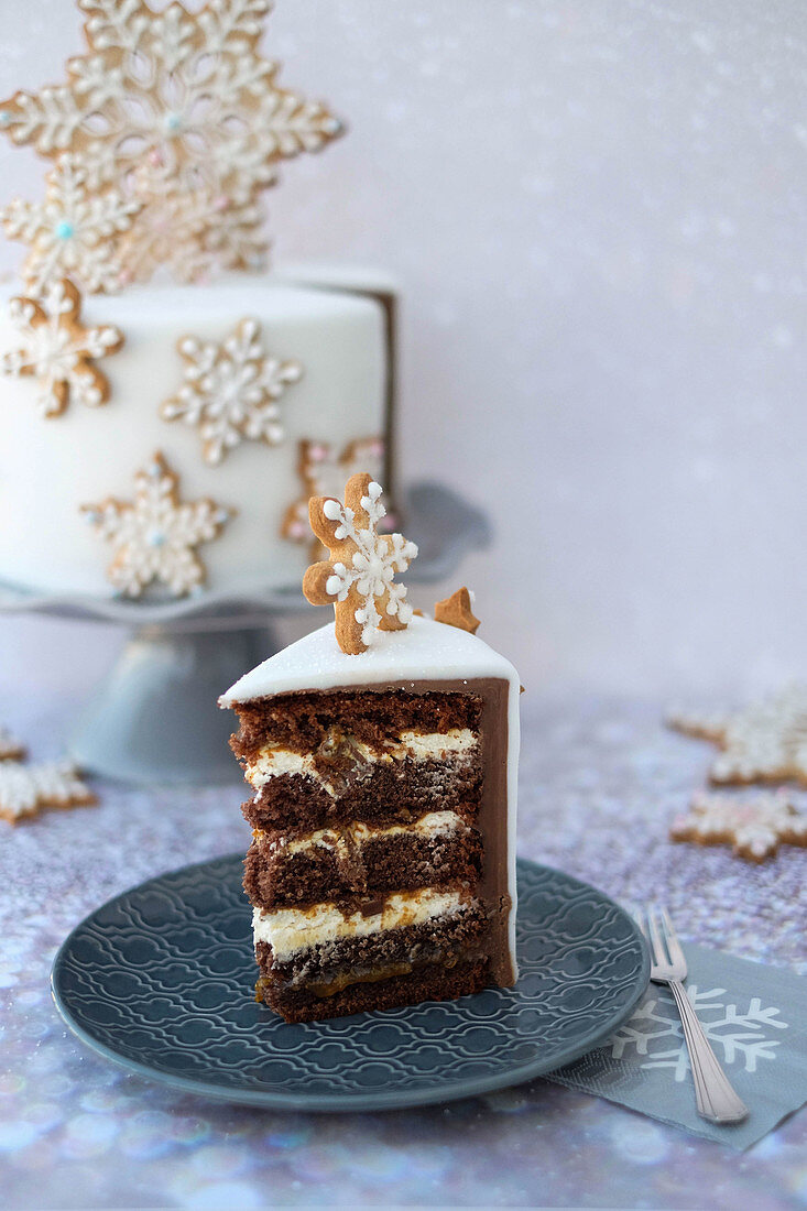 A slice of Christmas cake decorated with snowflakes