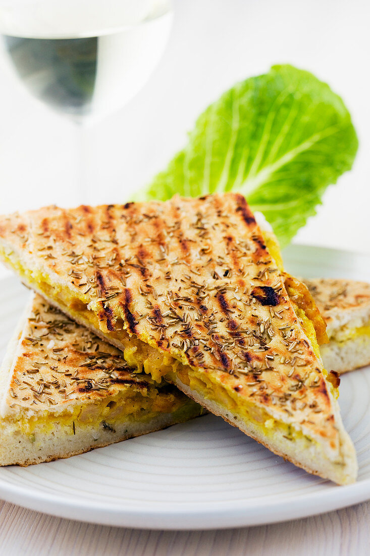 A grilled sandwich filled with vegetable spread