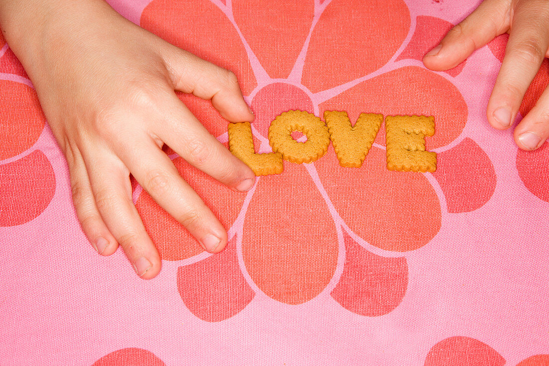 Love word made out of letter biscuits