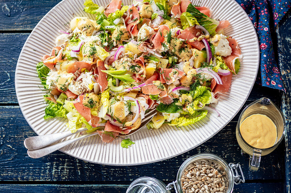 Potato, prosciutto and mozzarella salad with mustard dressing