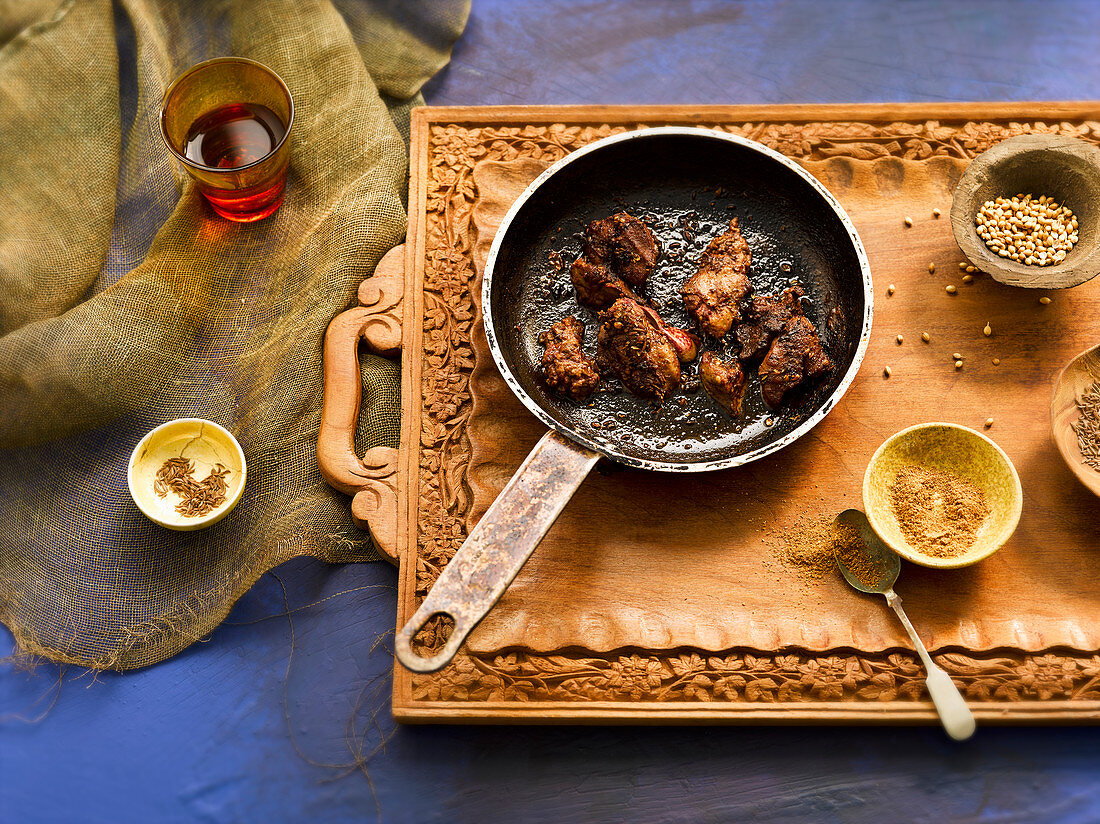 Spicy chicken liver in a pan