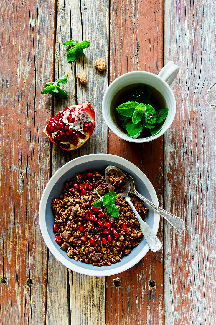 Chocolate granola with pomegranate and mint tea