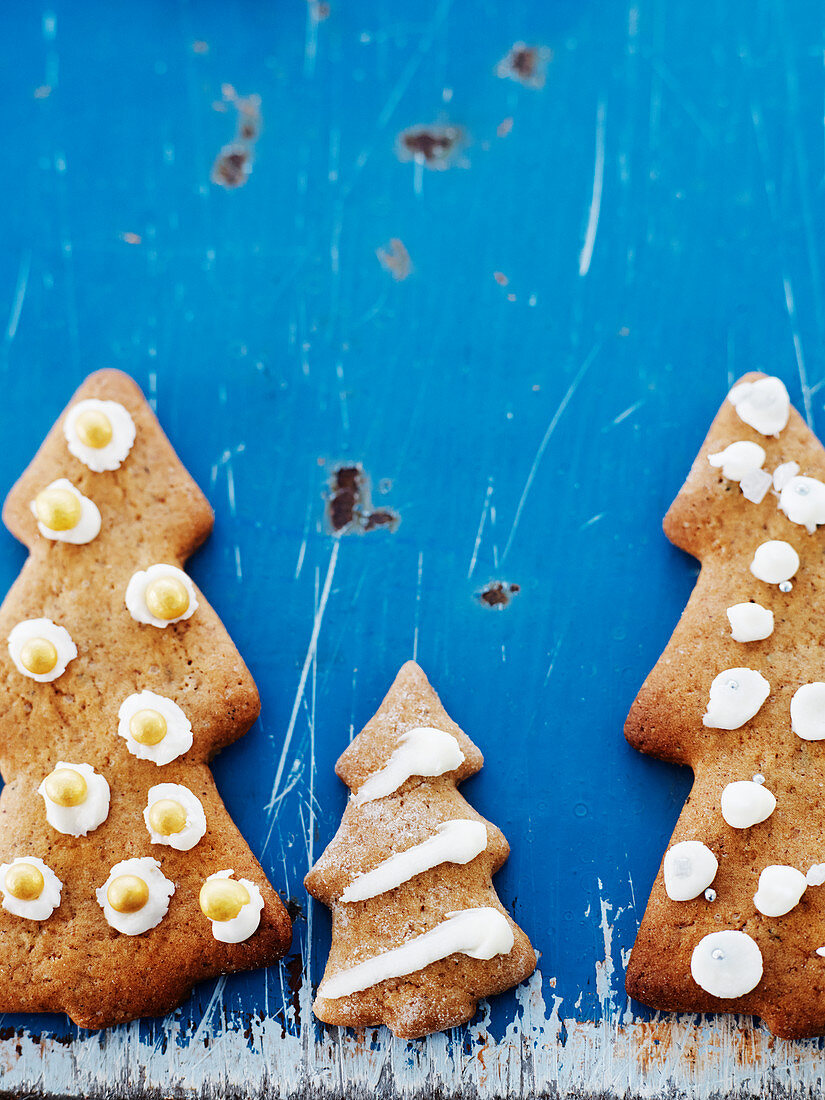 Christmas tree cookies on blue background