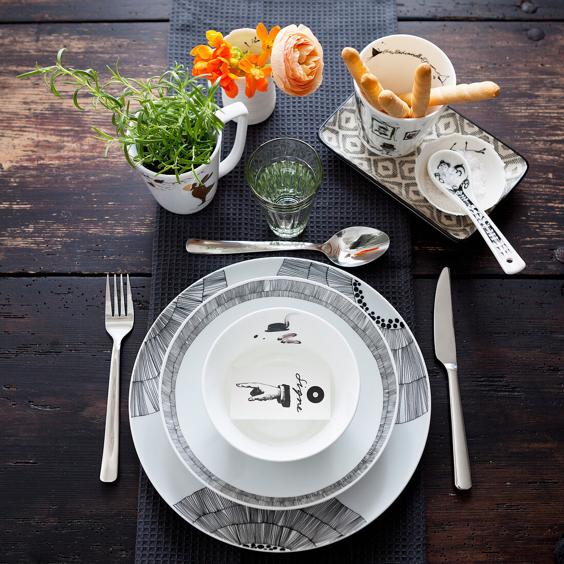 A modern place setting in black and white