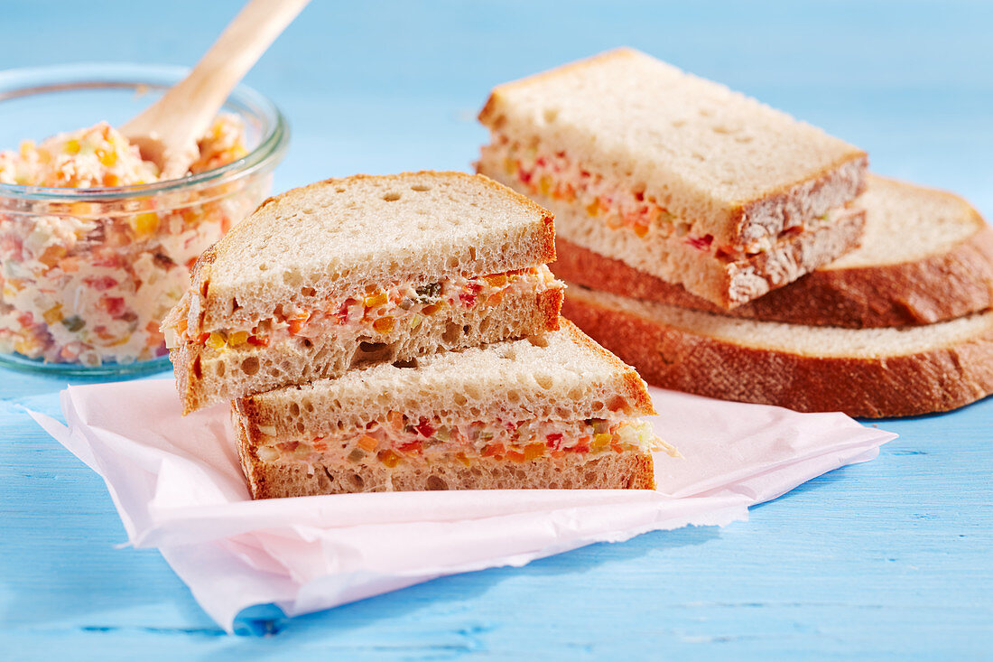 Sandwiches filled with homemade sausage spread with celery and peppers