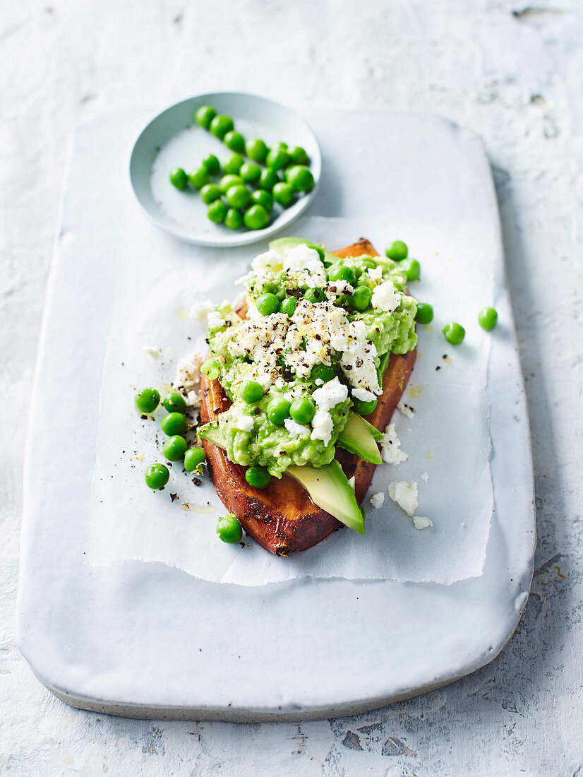 Vegeterian sweet potato with peas, avocado and goat's cheese