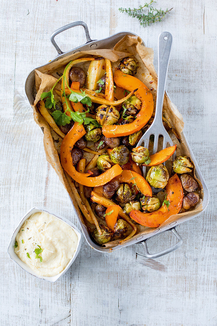 Oven-roasted vegetables with Brussels sprouts, pumpkin and parsnip with polenta