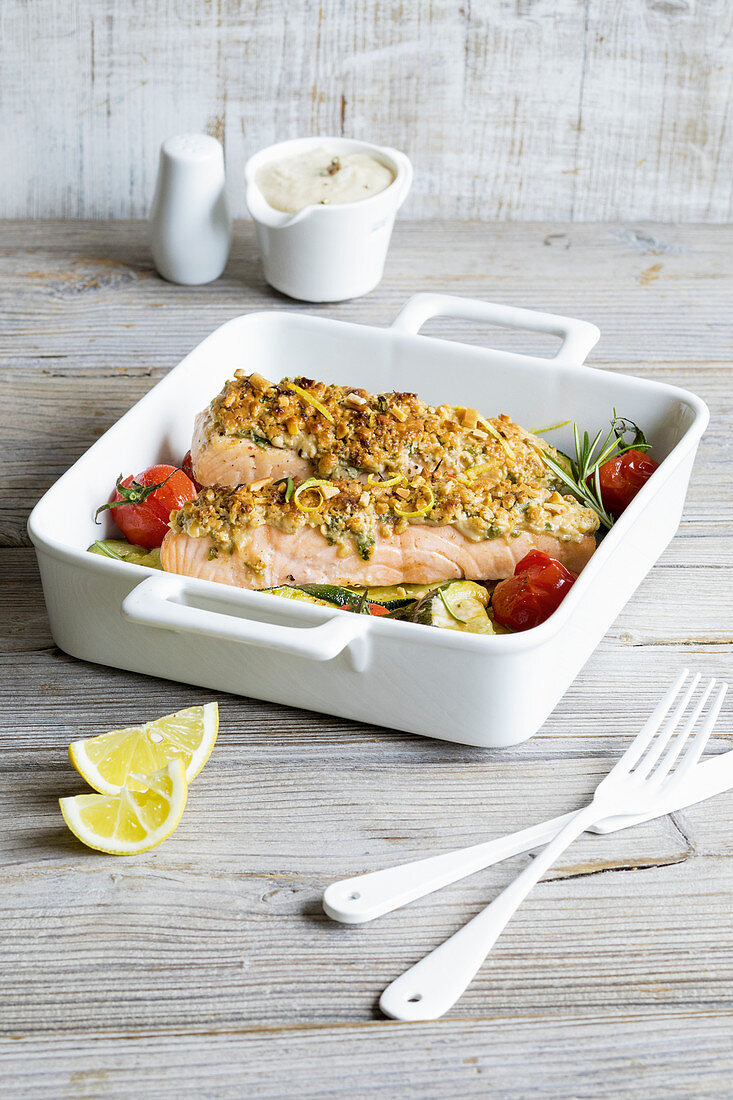 Lemon salmon with an almond crust on oven-roasted courgette