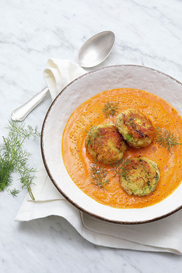 Smoked pepper and pumpkin soup with fish cakes