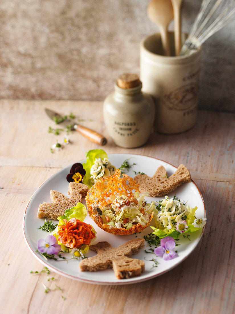 Chinese lettuce in a Parmesan bowl with bread birds