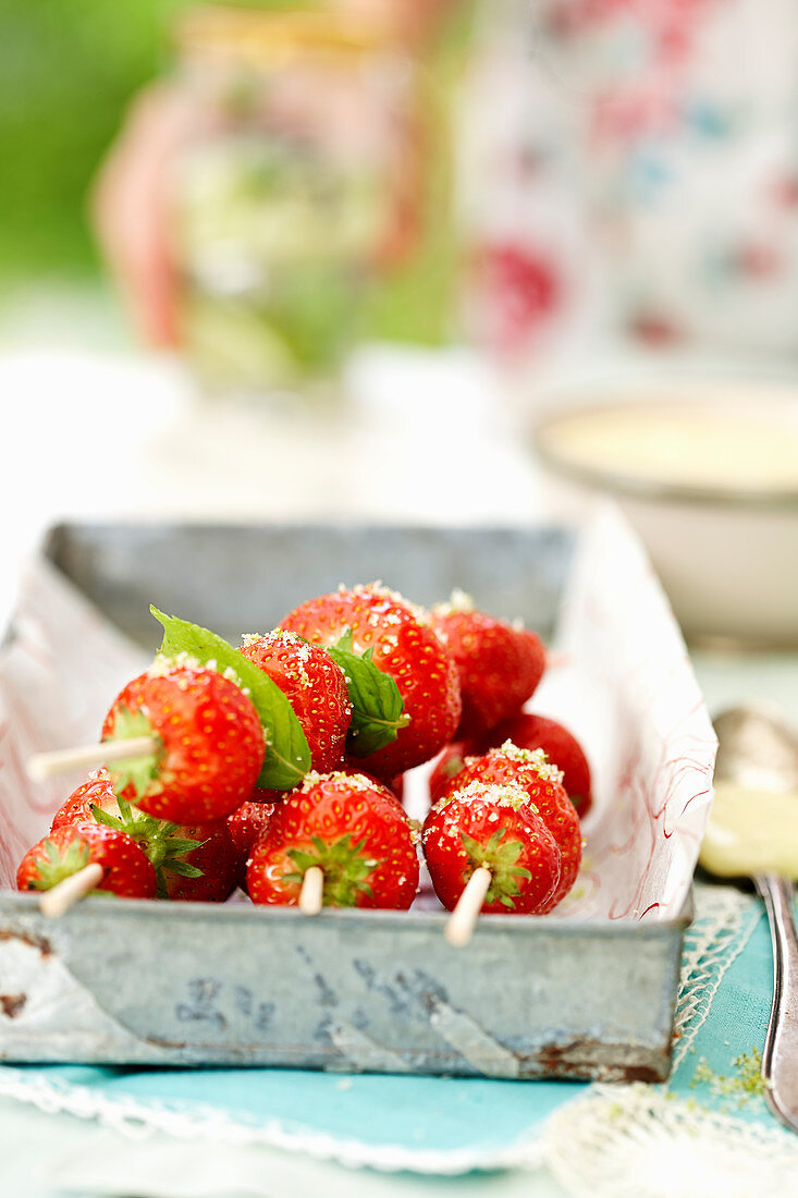 Strawberries skewers with basil