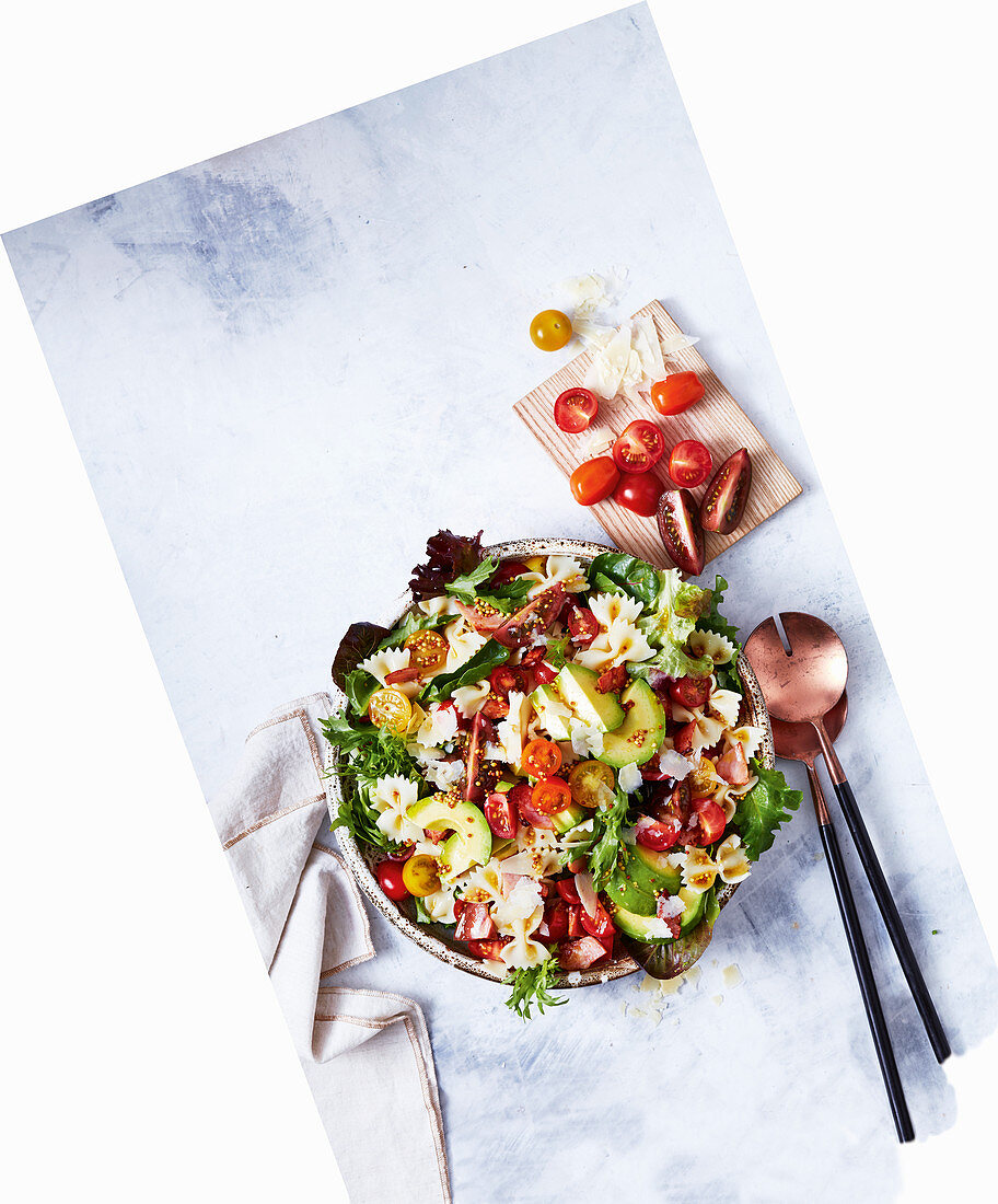 Blat farfalle salad with avocado and tomatoes