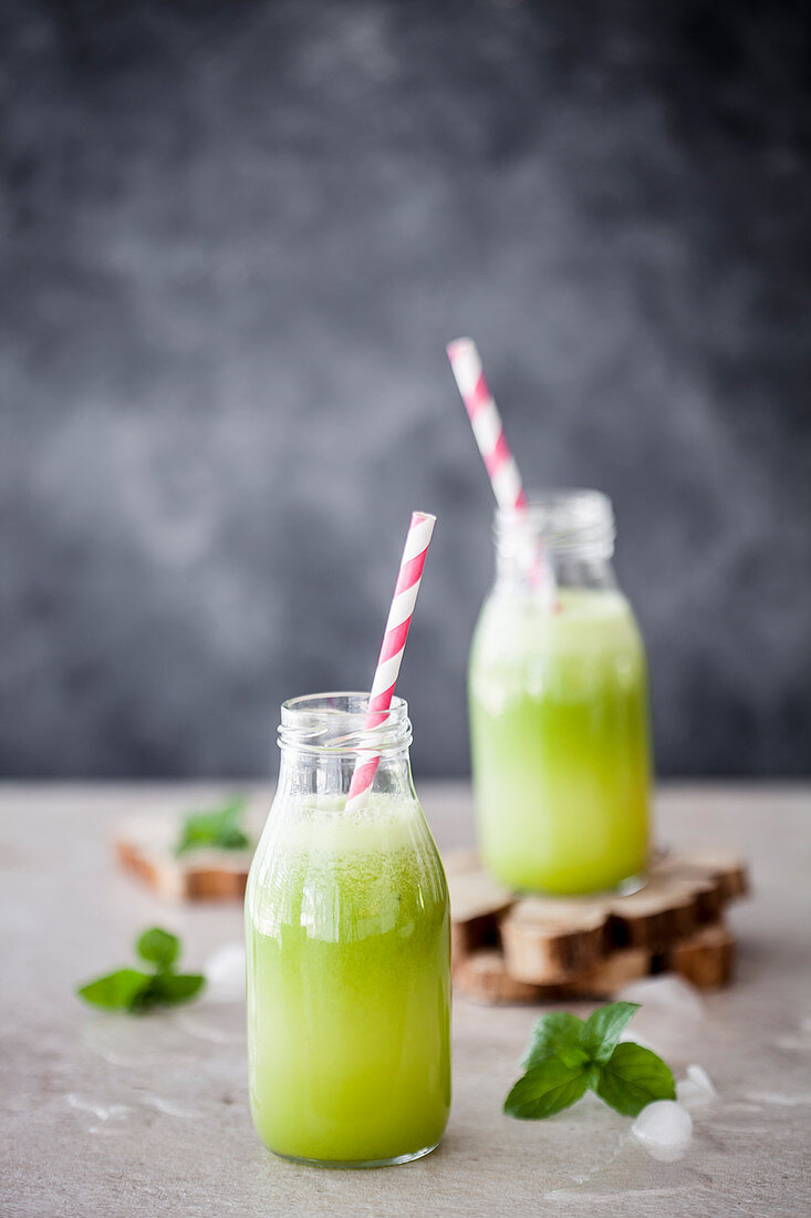 Healthy green juice with zucchini, pineapple, ginger, lemon and mint