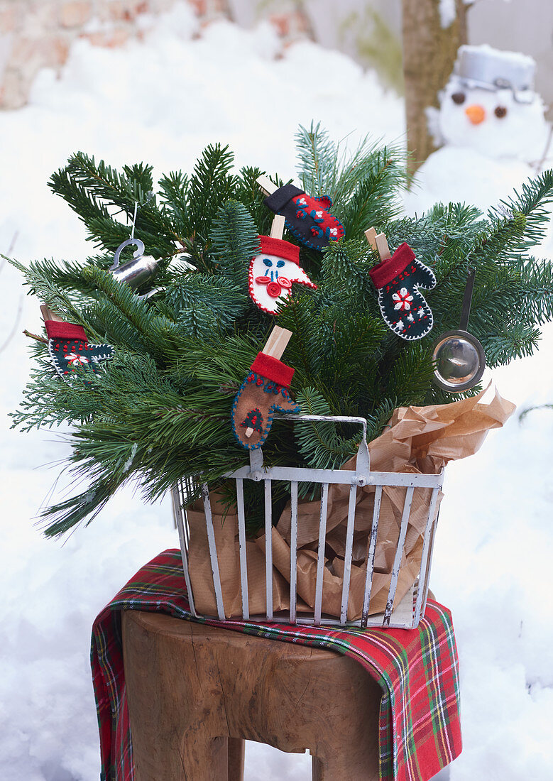 Christmas arrangement in metal basket