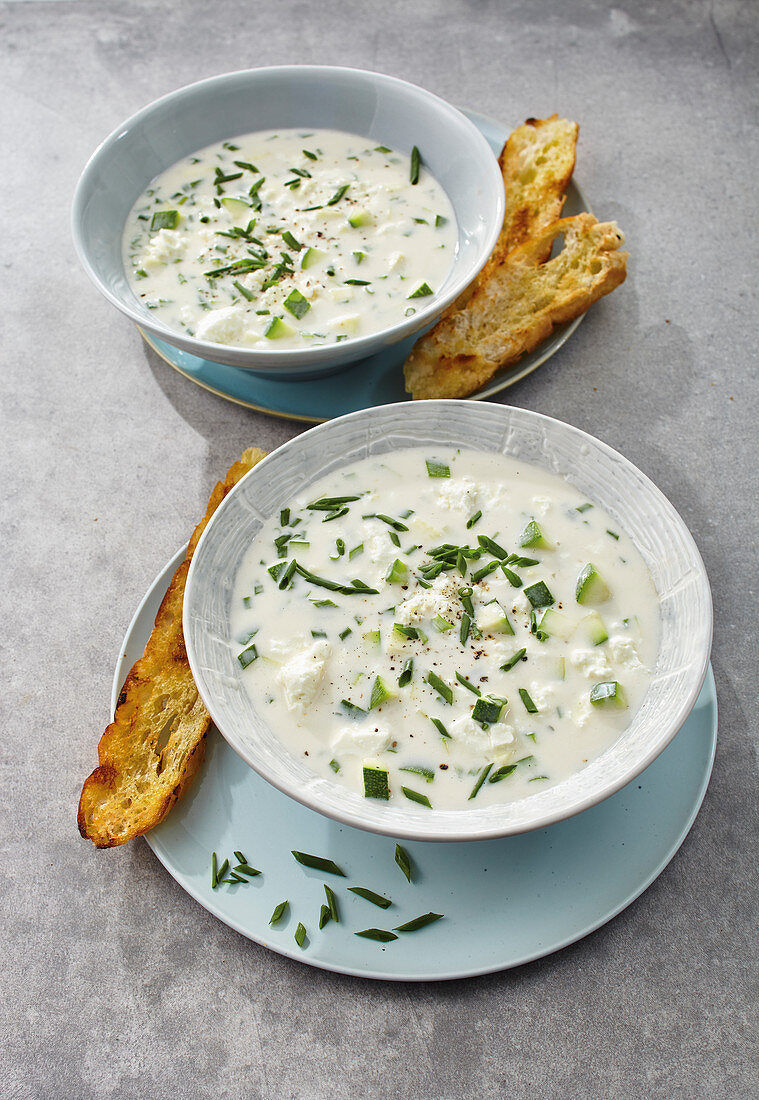 Courgette and coconut soup with sheep's cheese