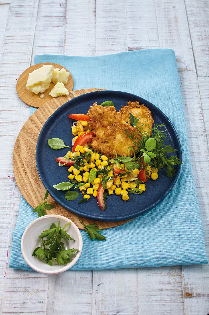 Curry chicken piccata with a sweetcorn and tomato salad