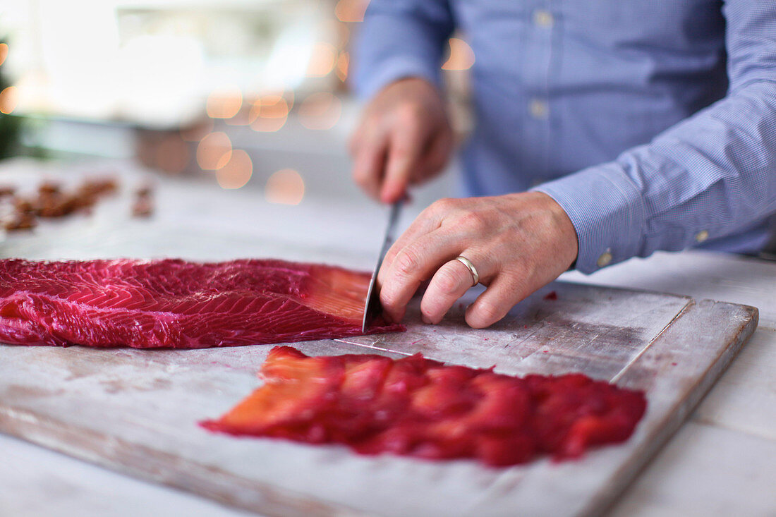 Filetting beetroot-cured salmon
