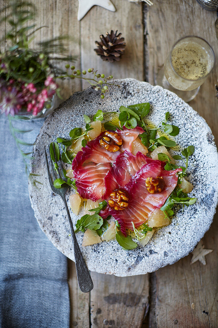 Beetroot-cured salmon with citrus salad and caramelised walnuts