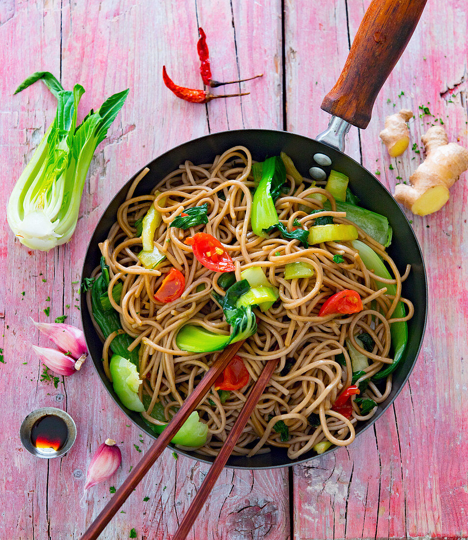Soba noodles with pak choi in a wok