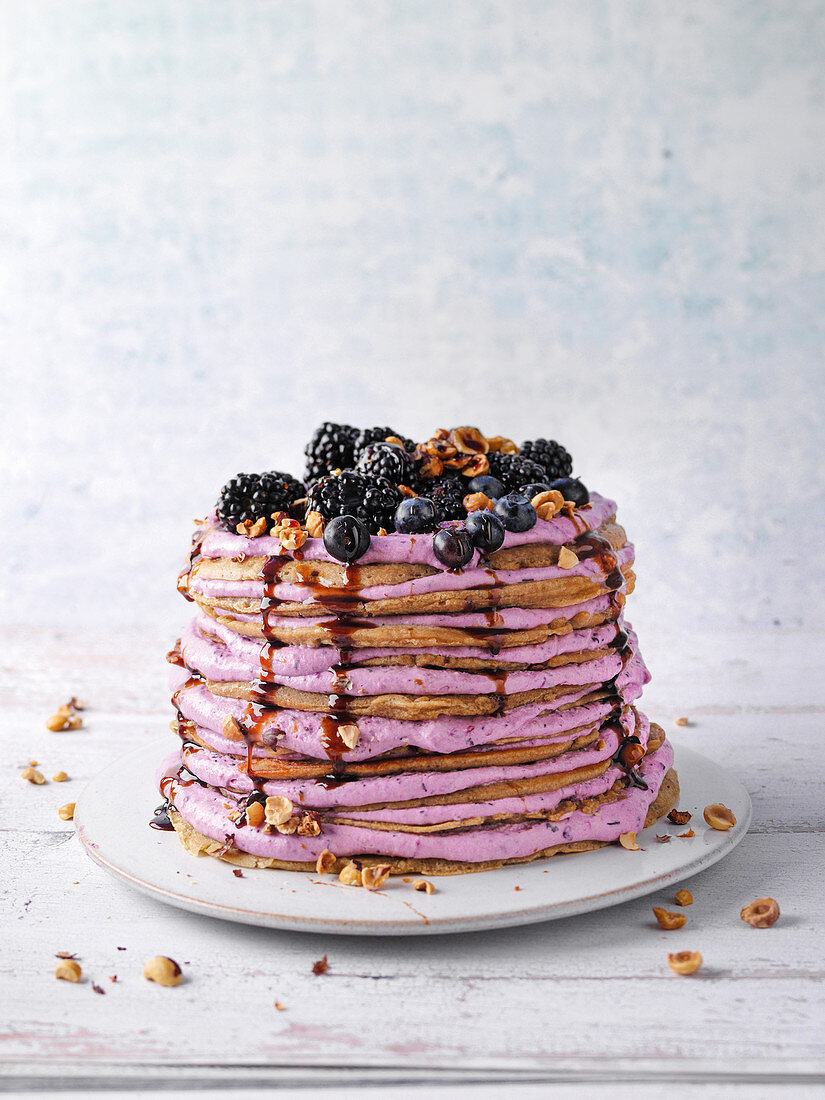 Rötsch cake with berry cream (pancake cake made with buckwheat and coffee)