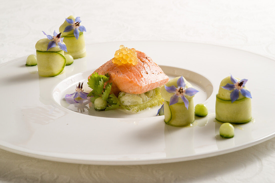 Gently cooked salmon trout fillet on a potpourri of cucumber