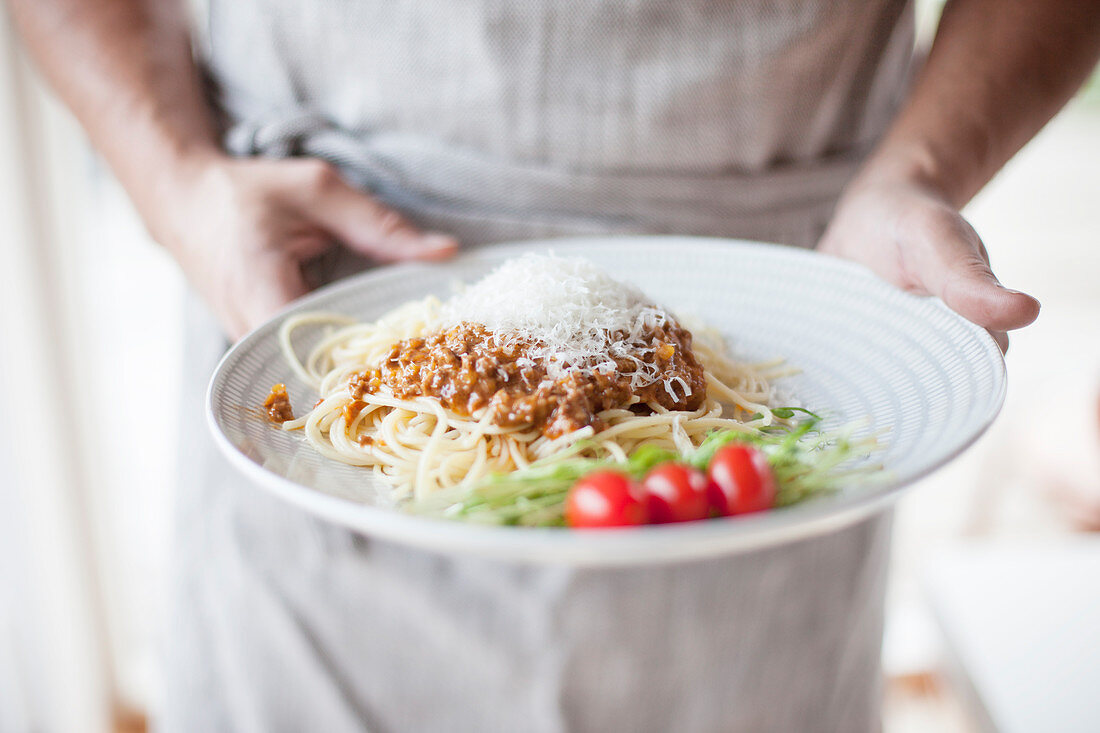 Man holding a plate with food