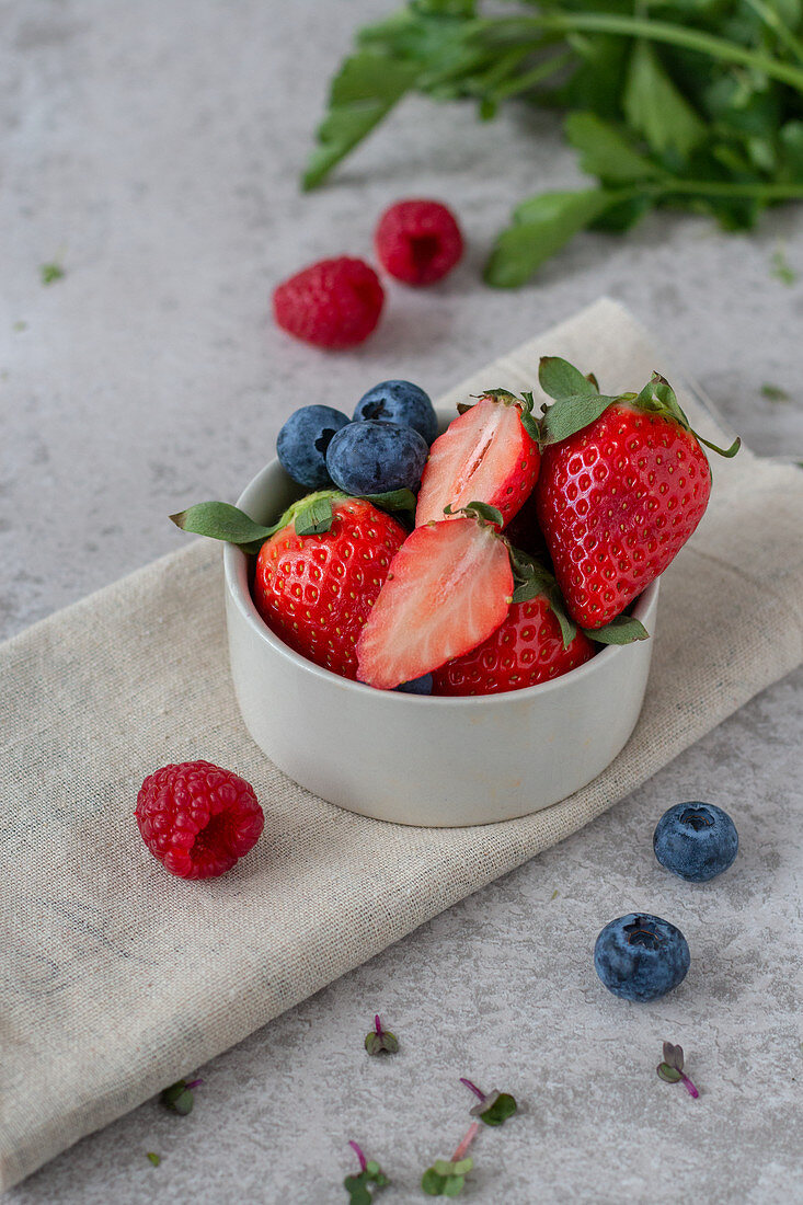 Strawberries, blueberries and raspberries in a bowl