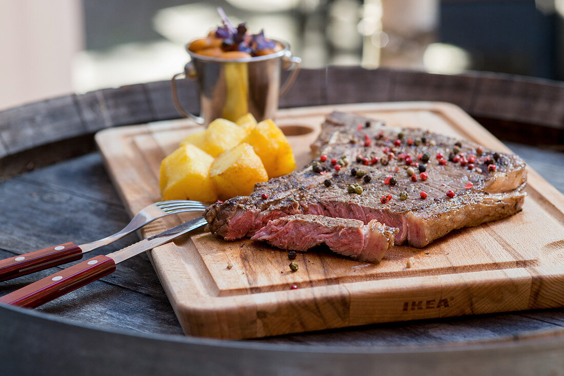 T-bone steak with bean goulash and fried potatoes