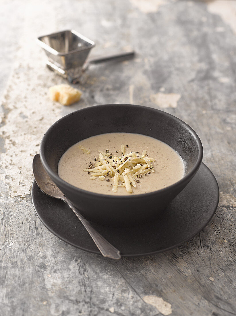 Mushroom soup with Parmagsian cheese and black pepper