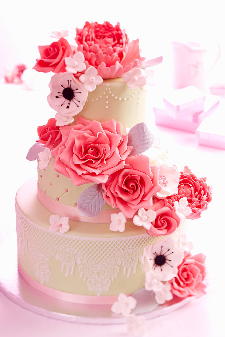 A wedding cake with roses and sugar flowers