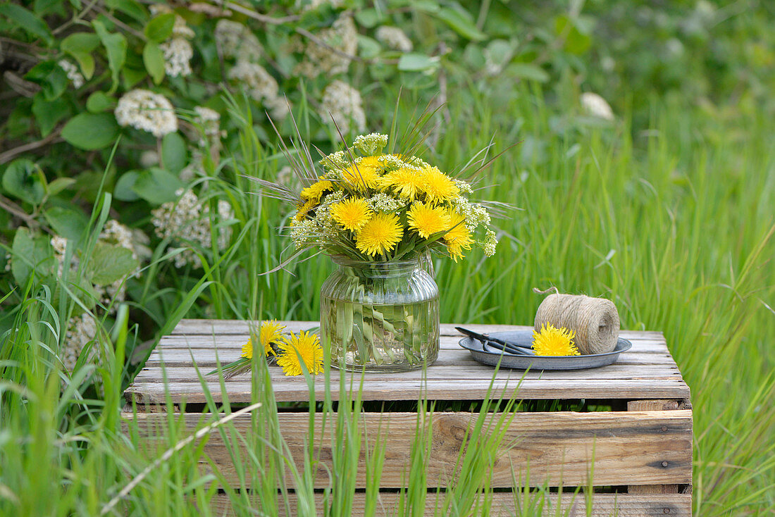 Bouquet of dandelions, cress and grass