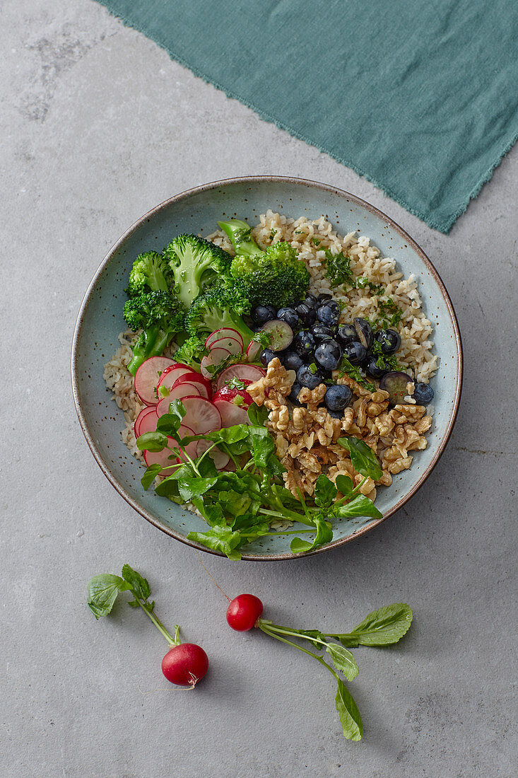 Superfood bowl with blueberries and water cress