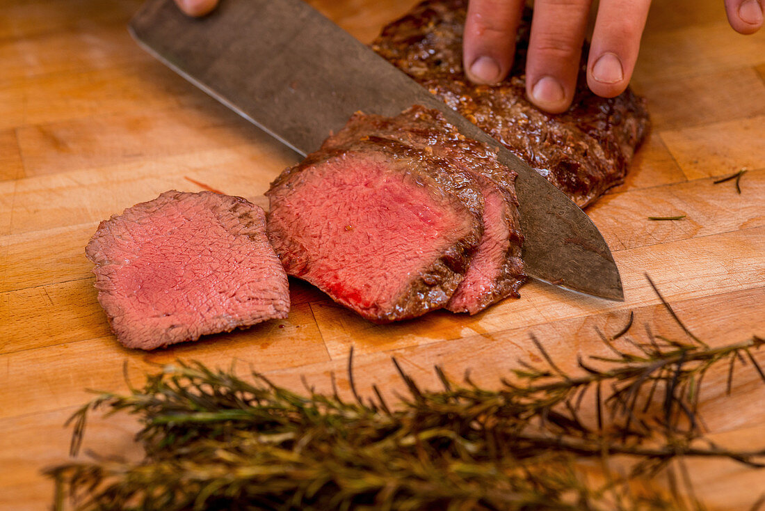 Sliced beef tenderloin with rosemary (medium rare)