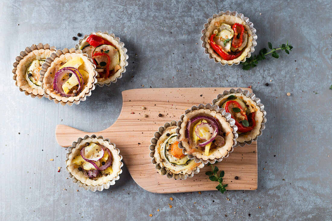 Tartlets with various vegetable fillings and mozzarella