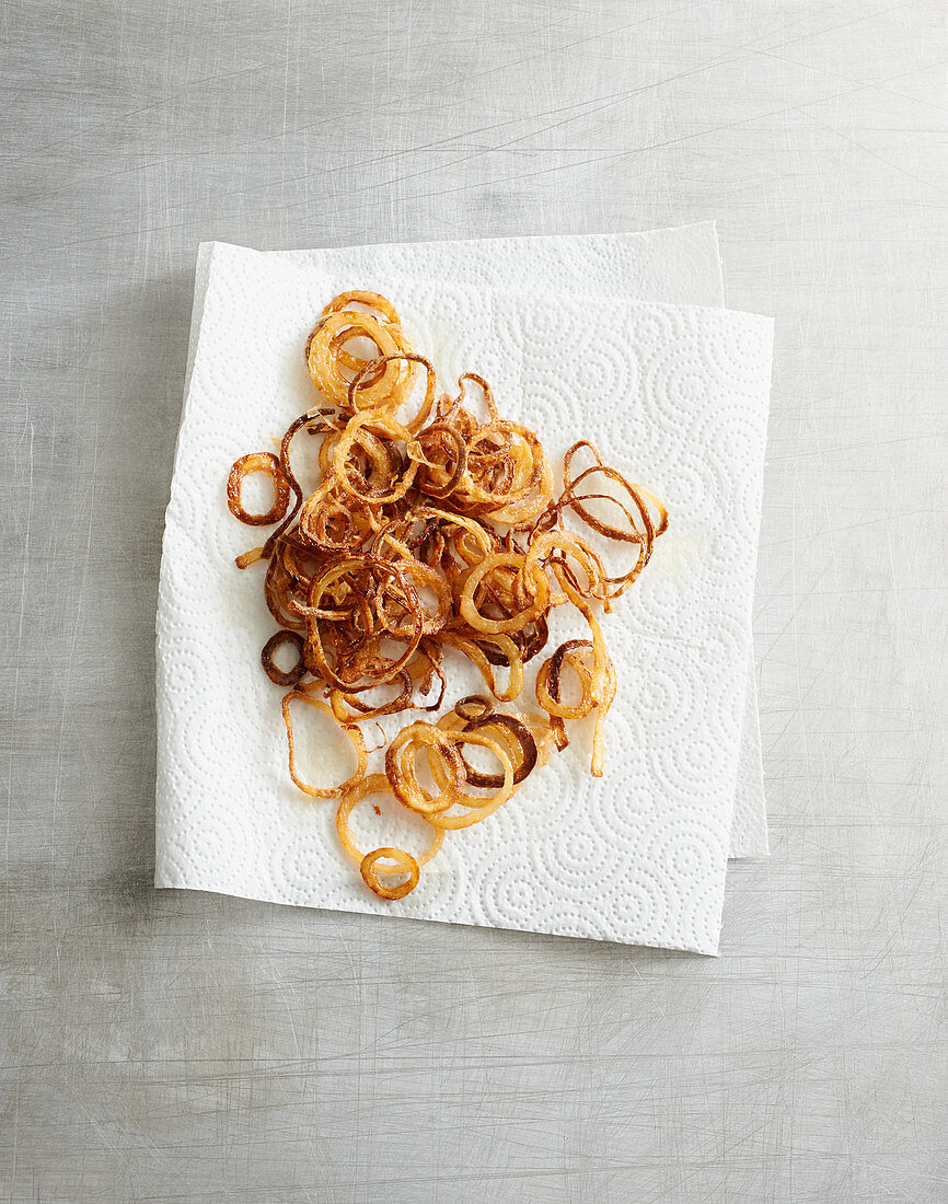 Fried onions on kitchen paper