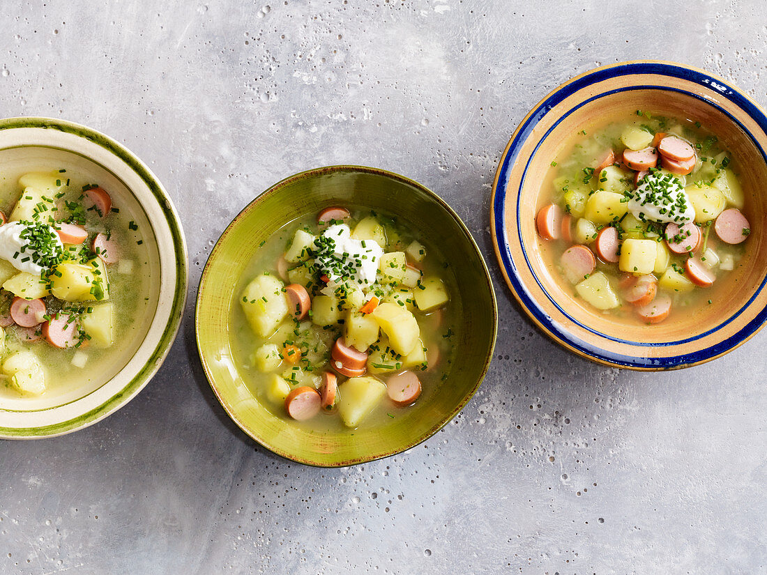 Hearty potato soup with hot dog sausages