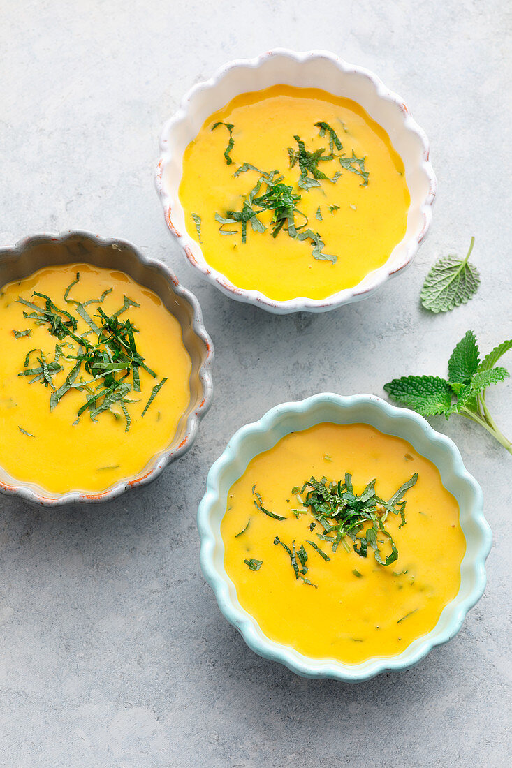 Pumpkin and potato soup with lemon balm