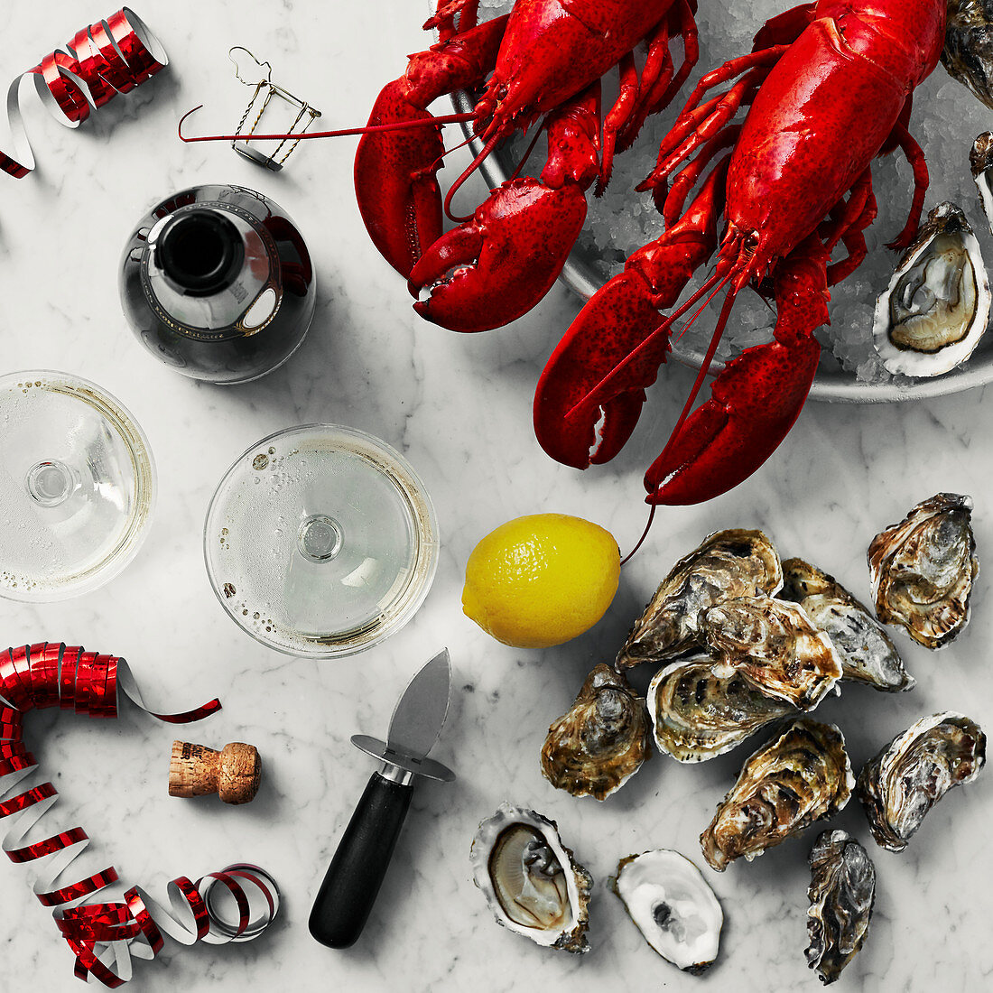 Lobsters on ice, fresh oysters, and sparkling wine for a party
