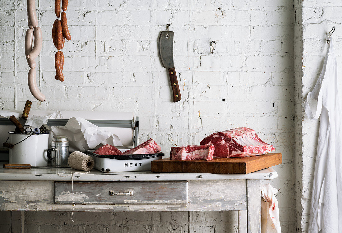 Vintage butcher counter against white brick wall