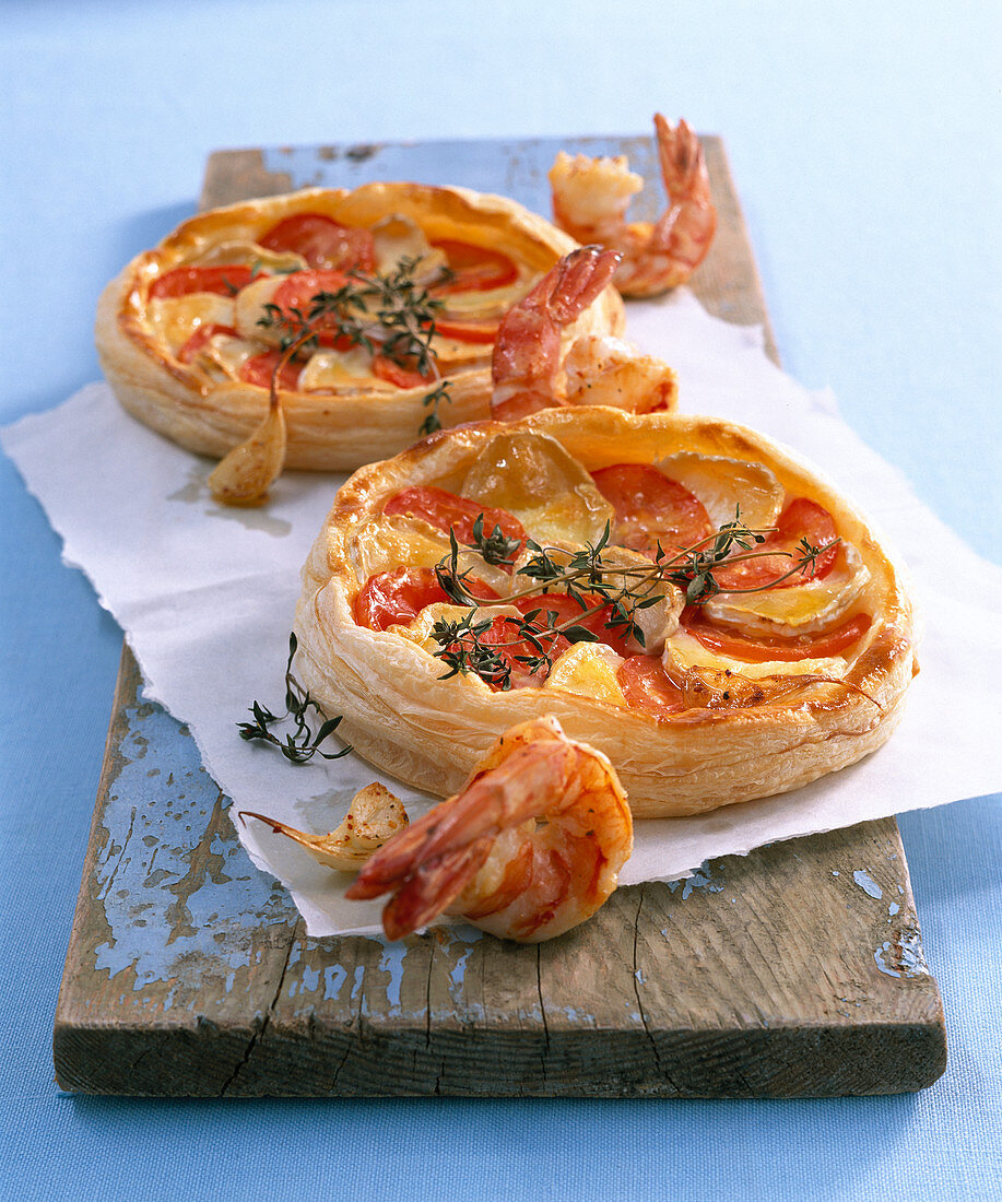 Tomato and cheese tarts and scampi