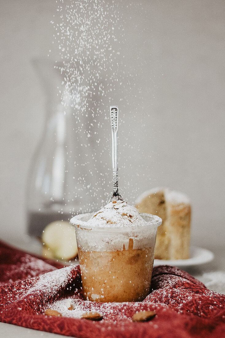 Christmas cake in a glass dusted with powdered sugar