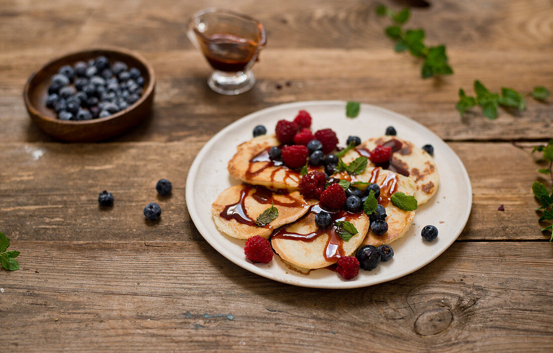 Pancakes with date syrup and berries
