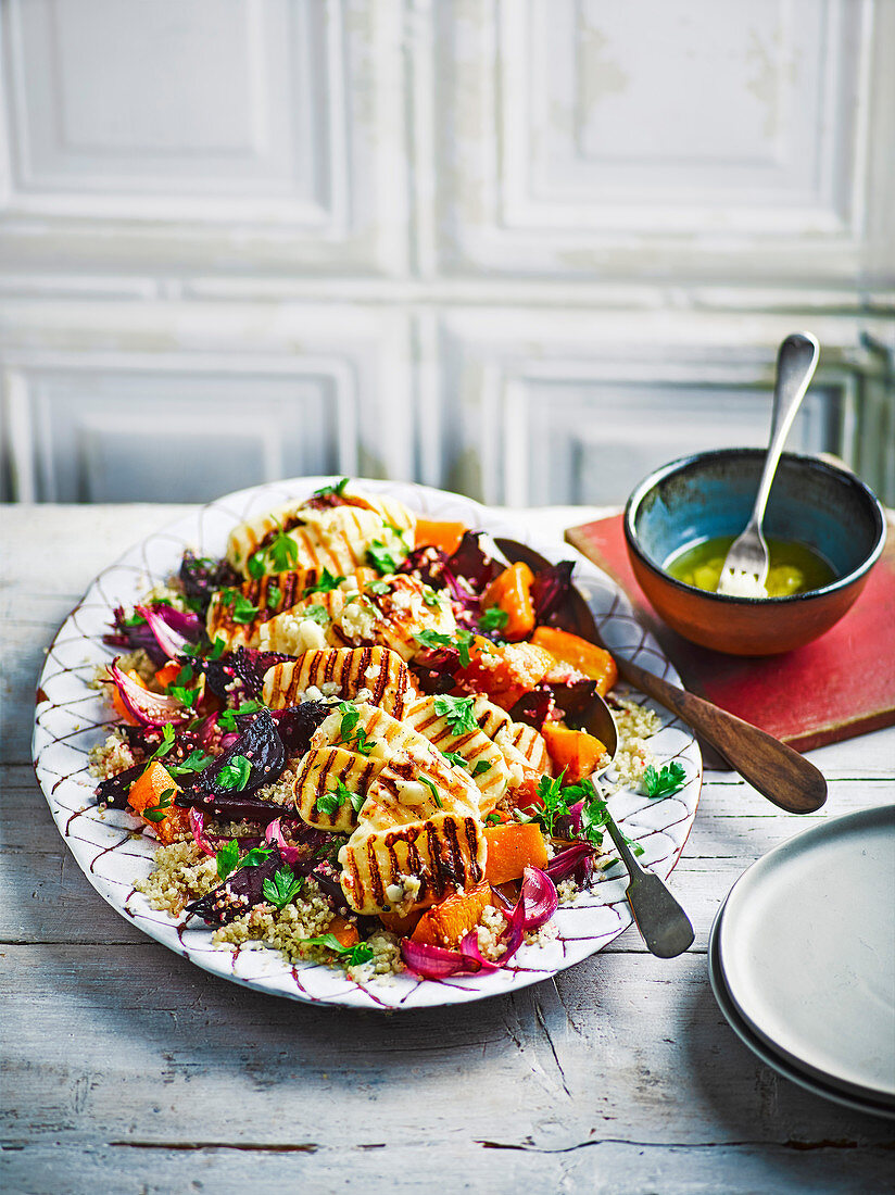 Quinoa salad with roasted vegetables and grilled halloumi