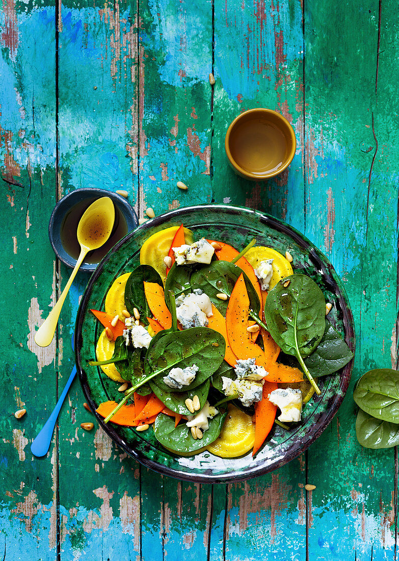 Spinach salad with pumpkin, yellow beet and blue cheese
