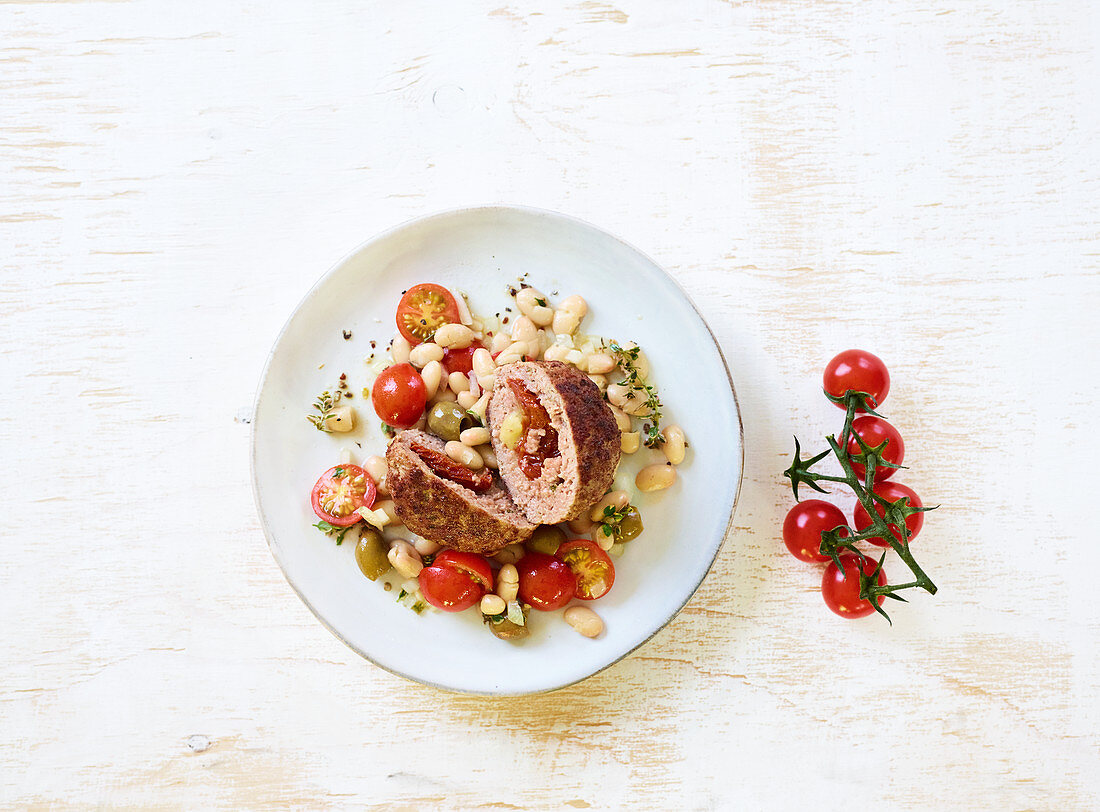 Stuffed meatballs with white beans and cherry tomatoes