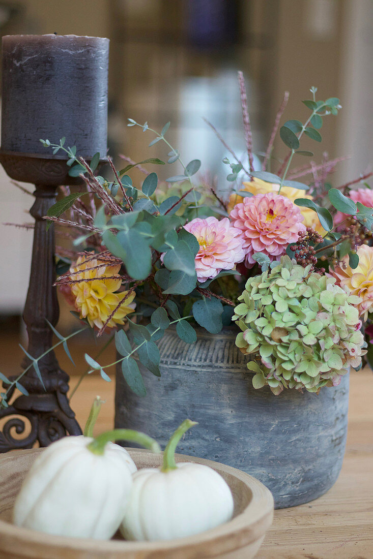 Autumn arrangement with hydrangea, dahlias, and eucalyptus, 'Baby Boo' pumpkin