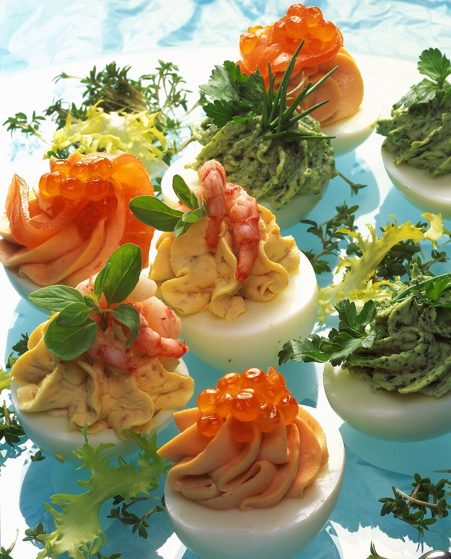Stuffed eggs with caviar, shrimp and herb mousses